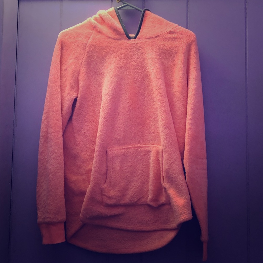 A pink jacket with gray around the hood